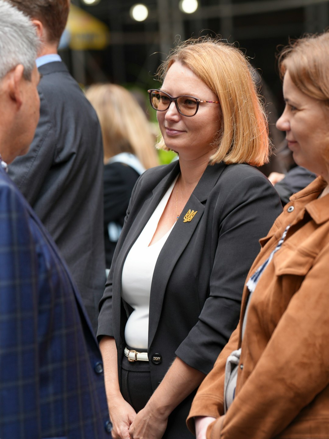 Two European professionals talking during a networking event