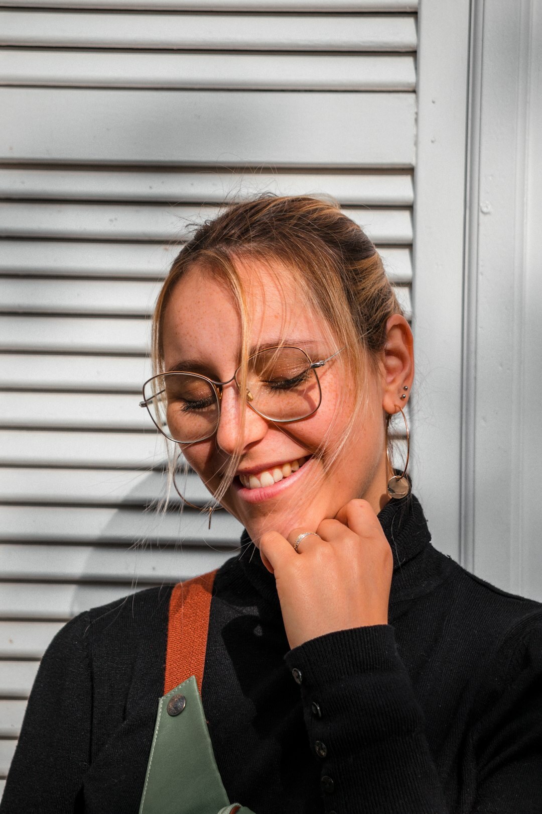 Studio portrait of a smiling Belgian businesswoman in business casual attire